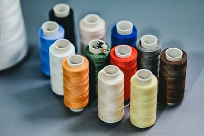 An arrangement of colorful thread spools.